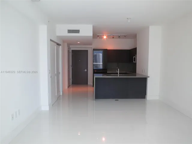 a view of a kitchen with a sink