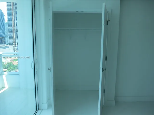 a bathroom with a glass shower door
