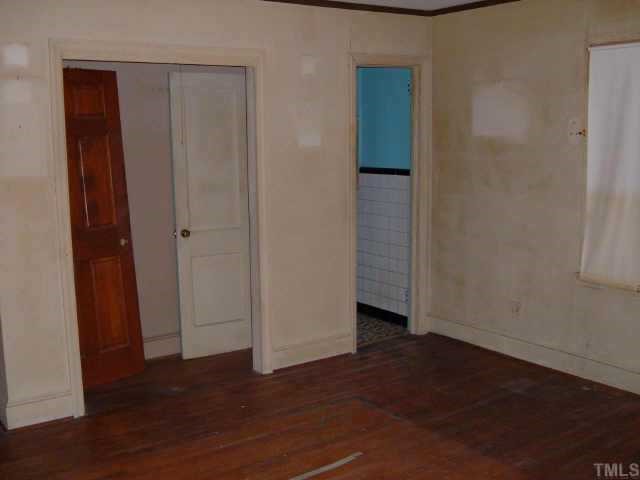 3420 Churchill Road Raleigh, NC 27607 - Photo 10 of 10 an empty room with wooden floor