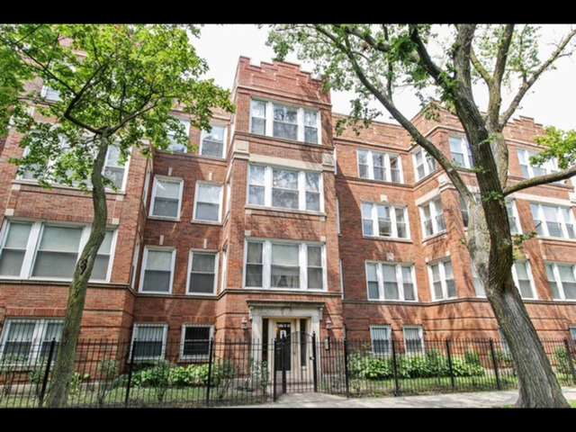 6704 South Ridgeland Avenue, Unit 2D Chicago, IL 60649 - Photo 1 of 11 a front view of a multi story residential apartment buildings
