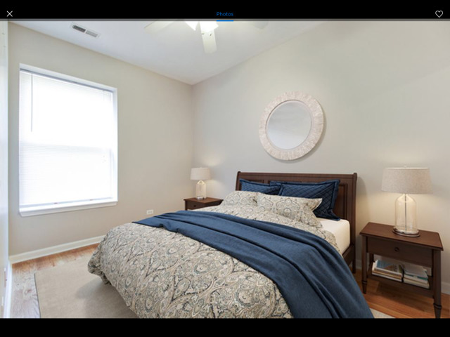6704 South Ridgeland Avenue, Unit 2D Chicago, IL 60649 - Photo 7 of 11 a bedroom with a bed and window