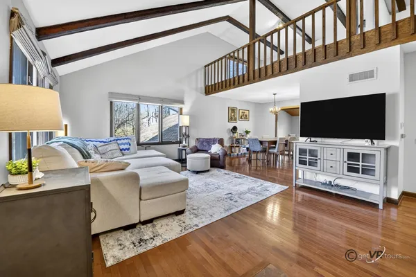 a view of hallway with wooden floor