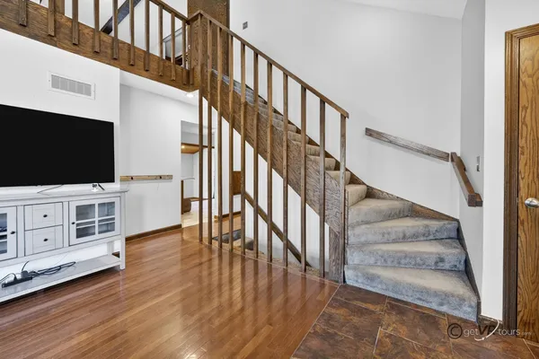 a living room with furniture and a rug