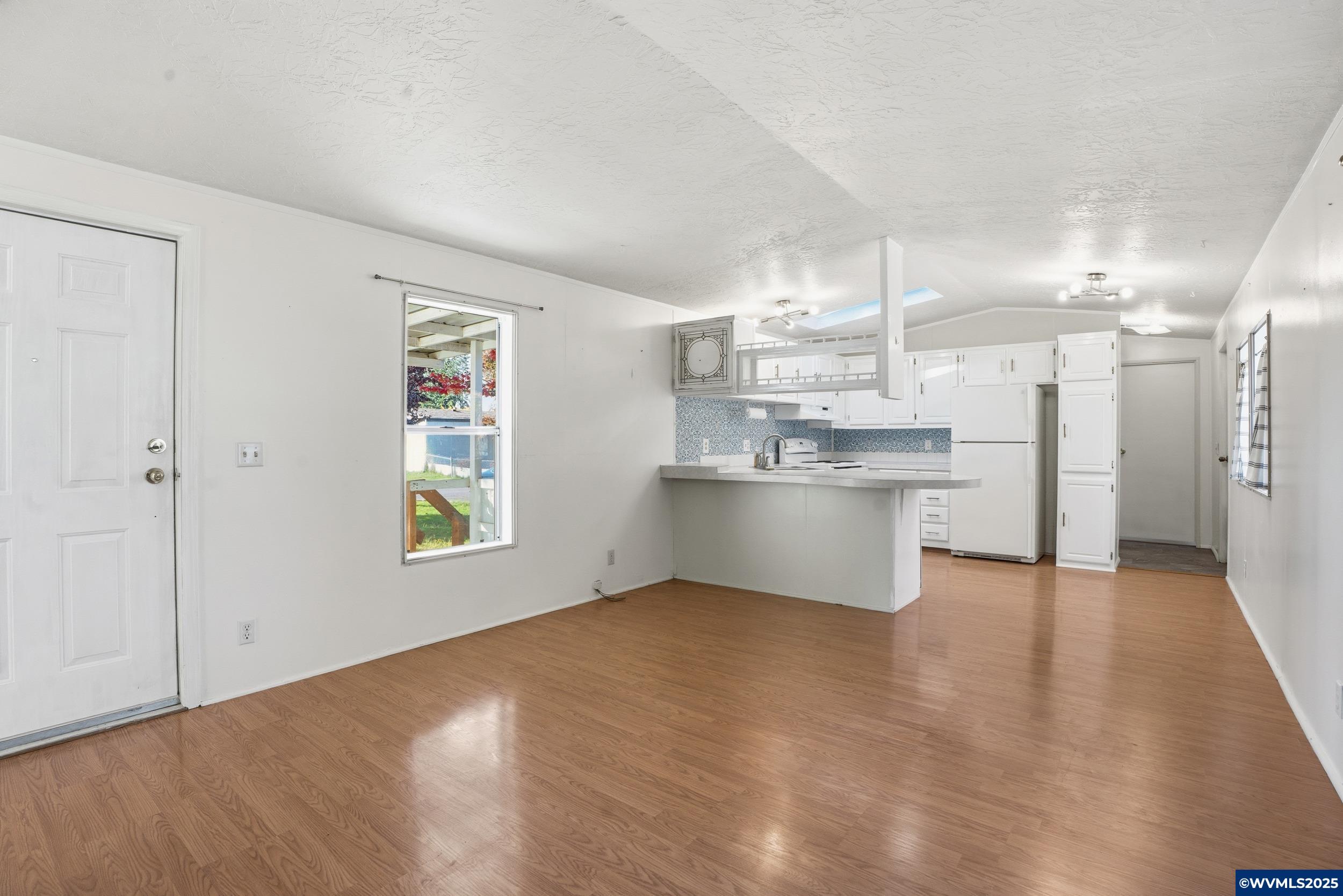 277 Edwards Road, Unit 145 Monmouth, OR 97361 - Photo 3 of 47 a view of kitchen with wooden floor