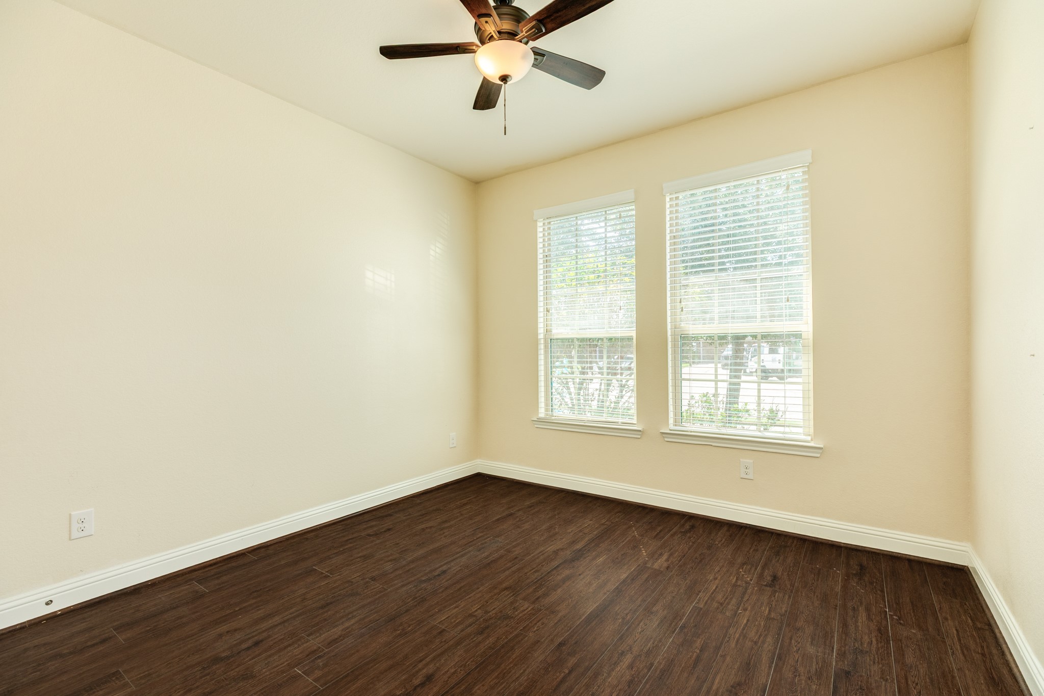 3519 Bay Drive Rosharon, TX 77583 - Photo 8 of 49 Secondary bedroom located on the street-facing side of the home, featuring two large windows that provide ample natural light.