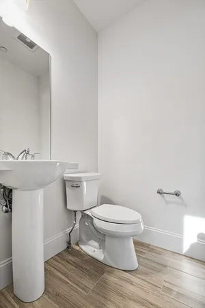 a bathroom with a toilet and a sink