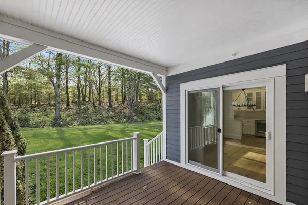 a view of balcony with yard