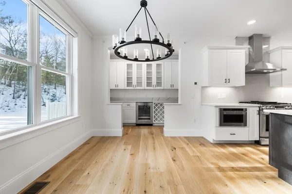 a view of a kitchen with microwave and stove