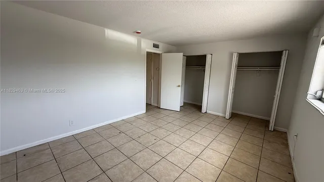 a bathroom with a sink toilet and a mirror