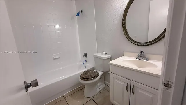 a bathroom with a toilet a sink and bathtub