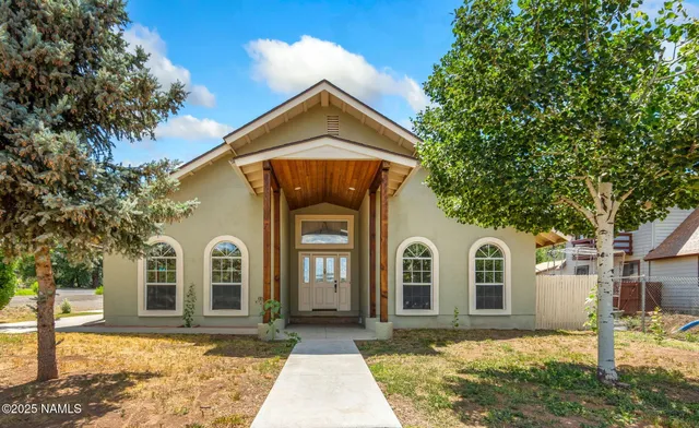 a view of house with yard