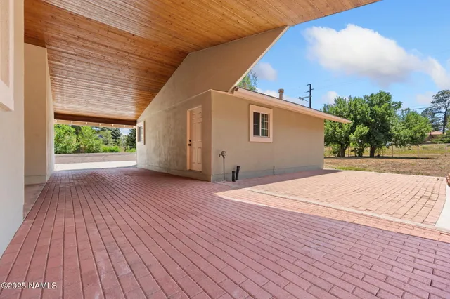 a backyard of a house with wooden floor