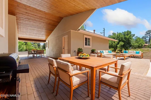 a dinning table and chairs in the patio