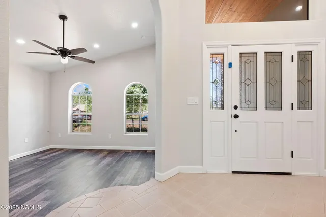 a view of an entryway with wooden floor