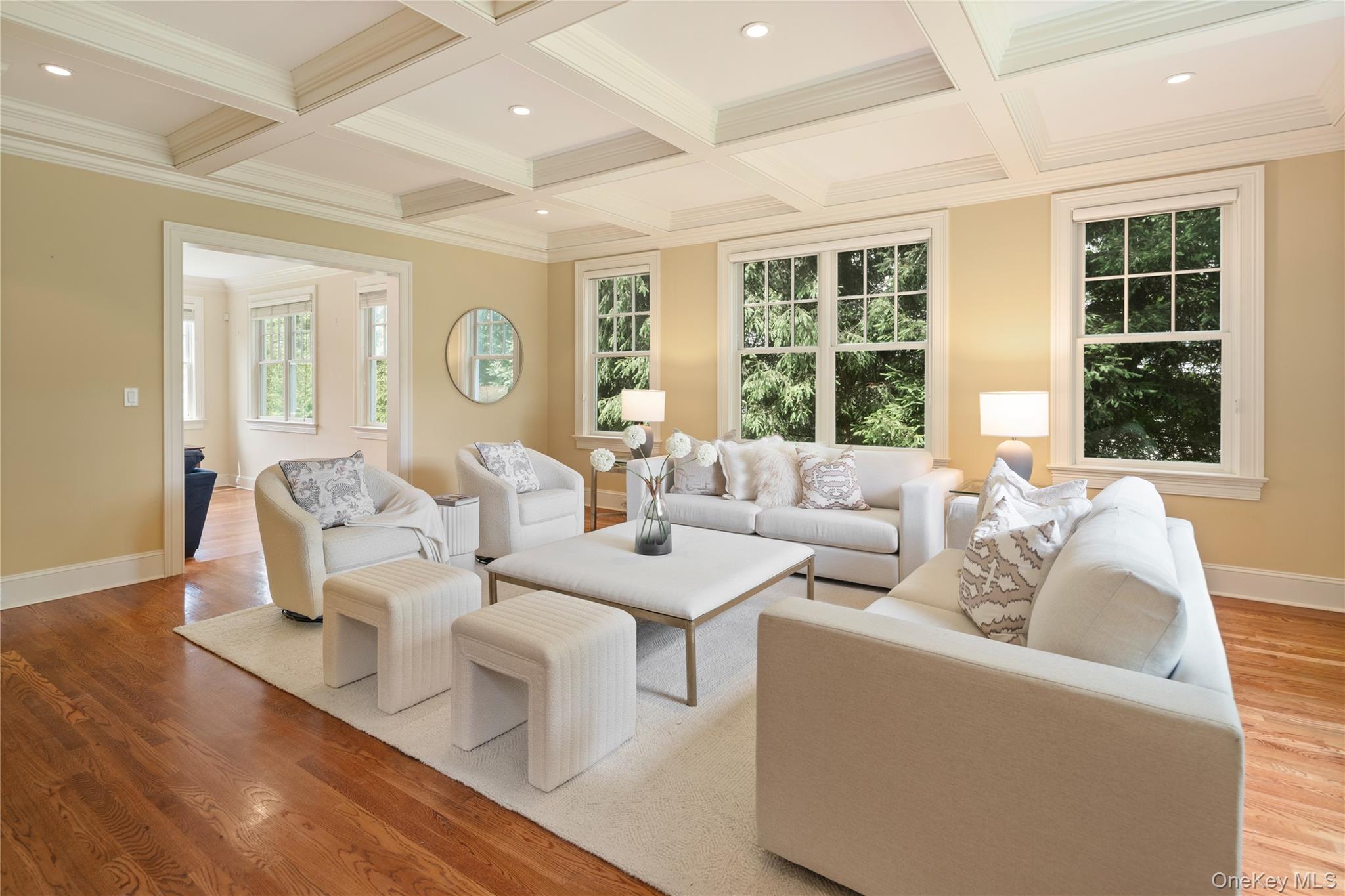 77 Byram Ridge Road Armonk, NY 10504 - Photo 8 of 48 Formal living room with coffered ceiling, recessed lighting, many windows and oak hardwood floors, open to the family room.