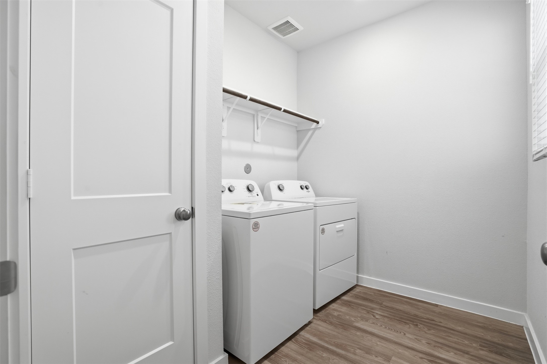 16994 Pandora Way Porter, TX 77365 - Photo 11 of 25 a utility room with cabinets washer and dryer
