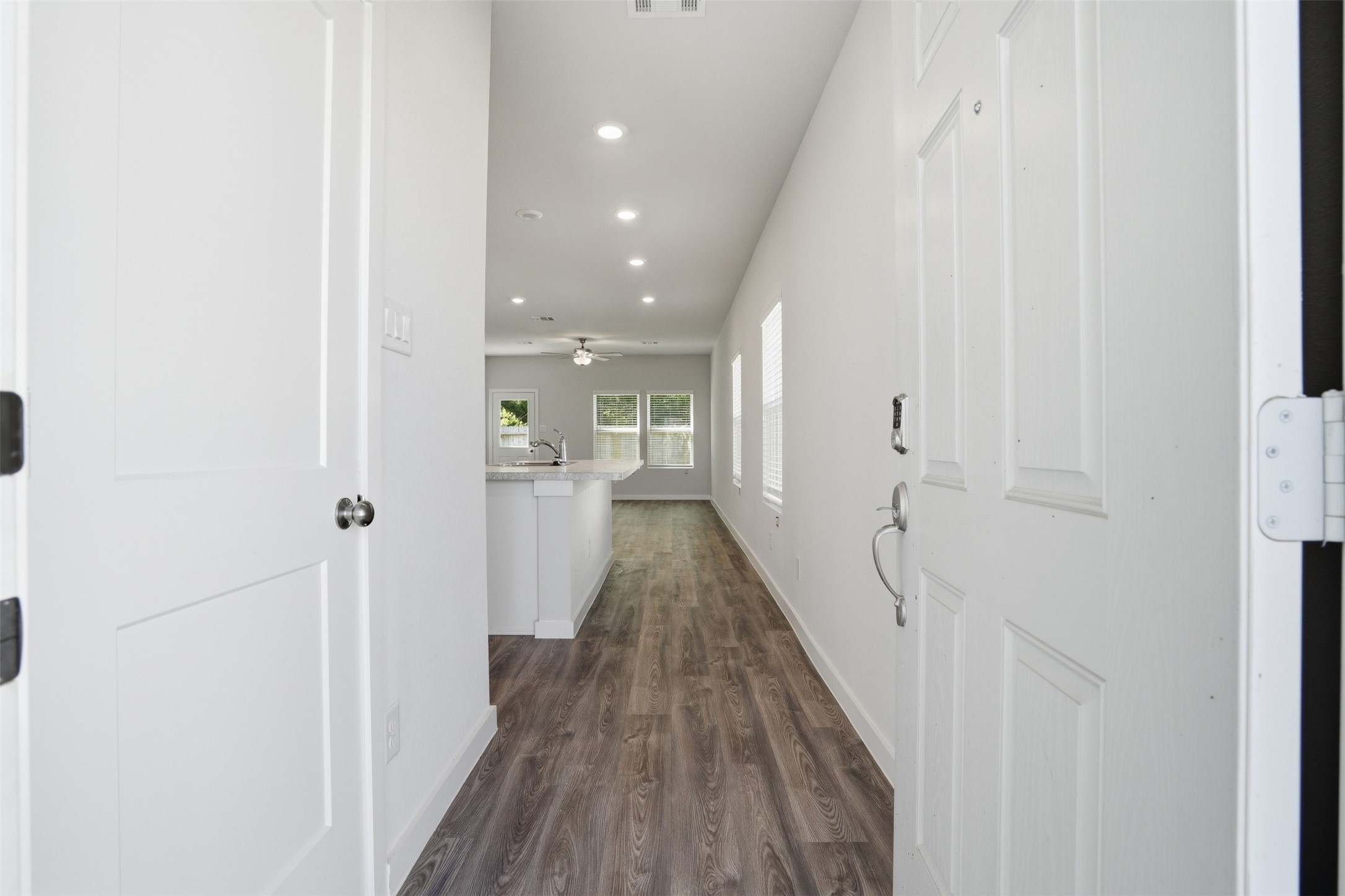 16994 Pandora Way Porter, TX 77365 - Photo 12 of 25 a view of a hallway with wooden floor