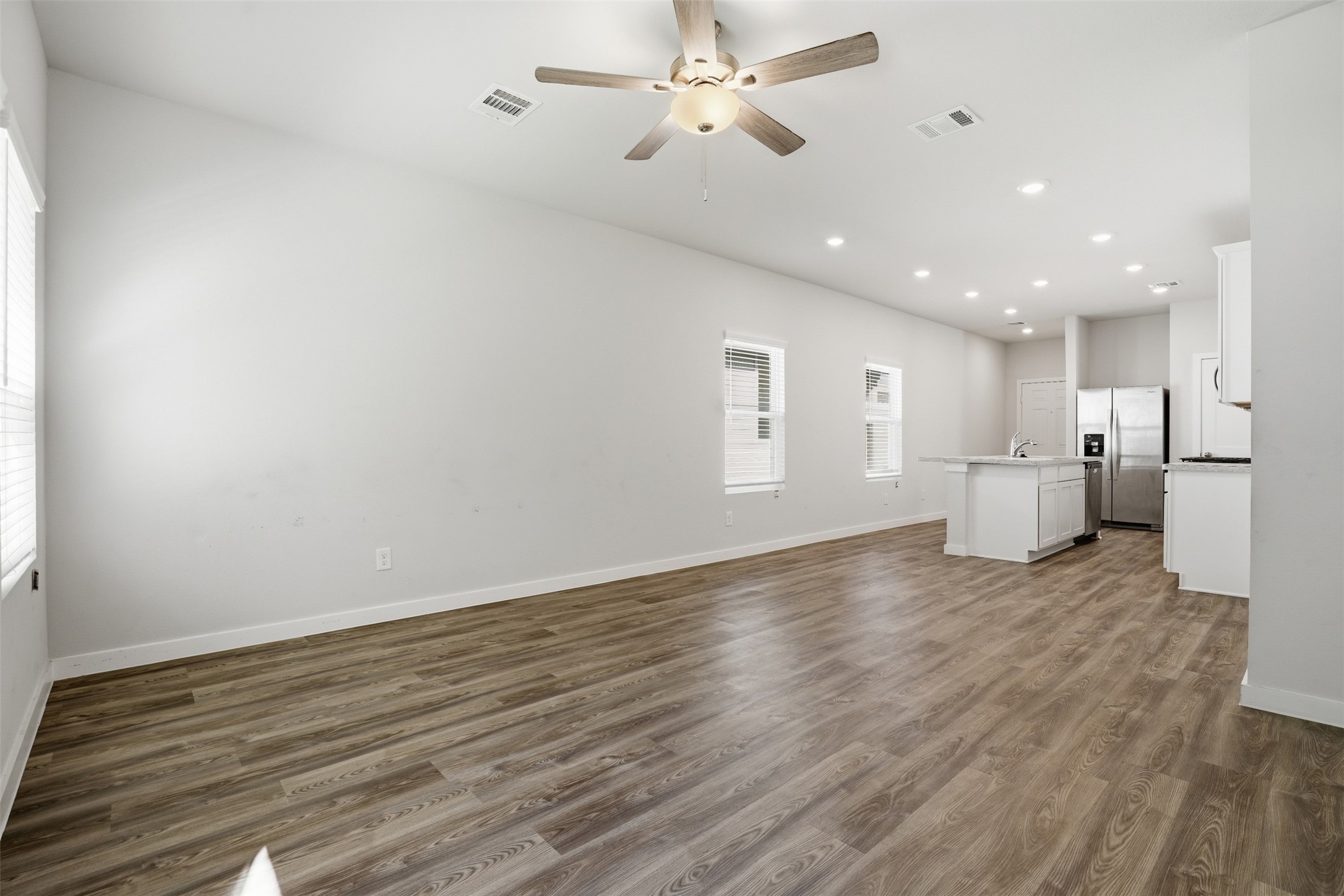 16994 Pandora Way Porter, TX 77365 - Photo 20 of 25 a view of a kitchen with a dishwasher and a refrigerator
