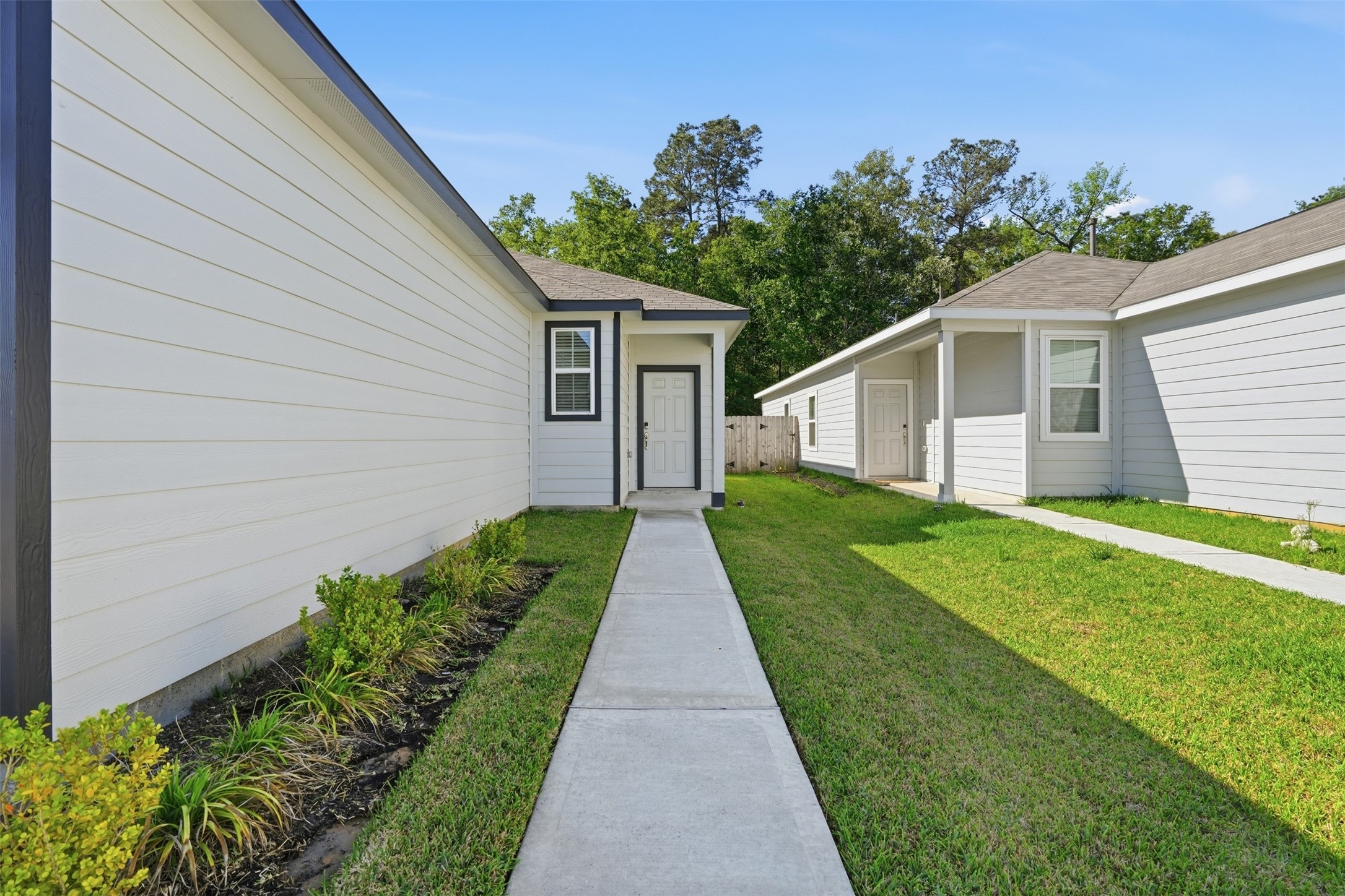 16994 Pandora Way Porter, TX 77365 - Photo 2 of 25 a view of a house with a yard
