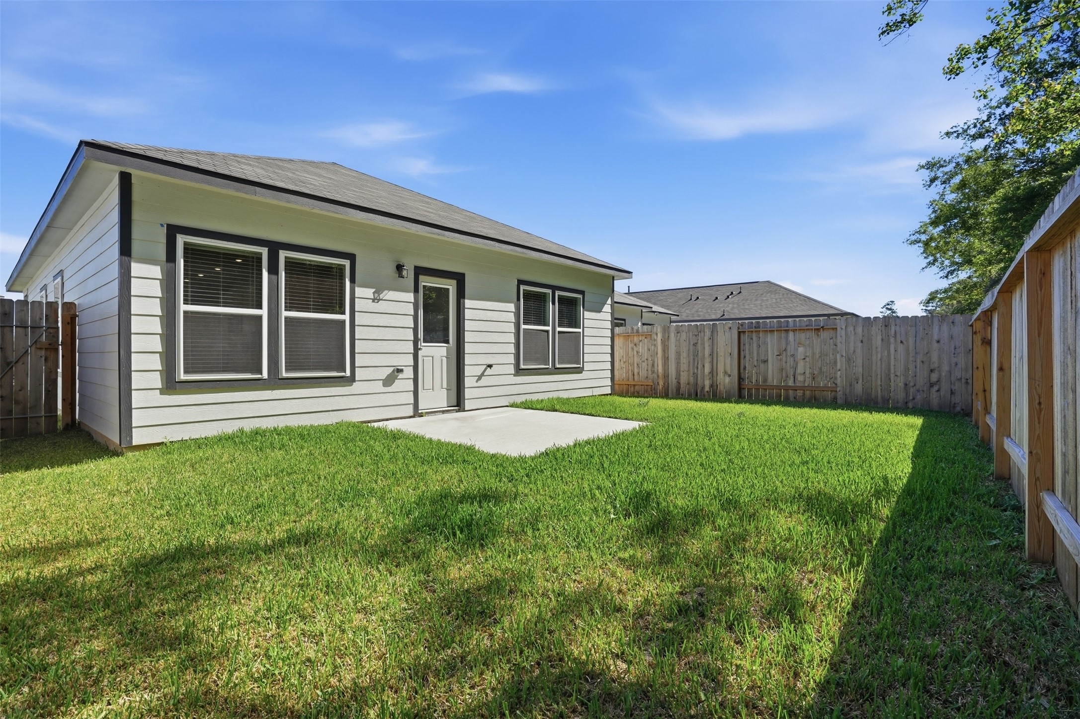 16994 Pandora Way Porter, TX 77365 - Photo 25 of 25 a view of a house with a yard and wooden fence