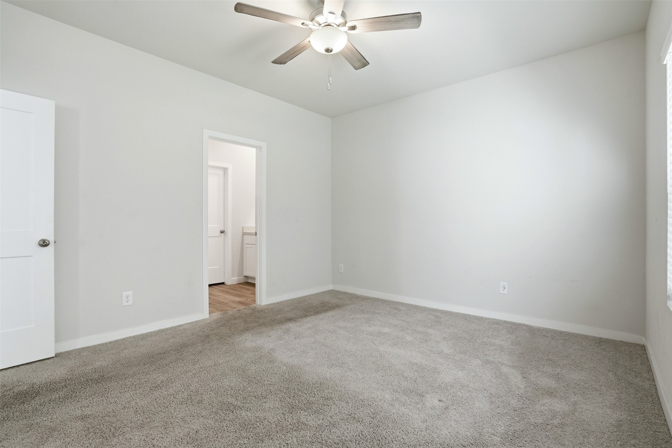 16994 Pandora Way Porter, TX 77365 - Photo 3 of 25 an empty room with chandelier fan and closet area