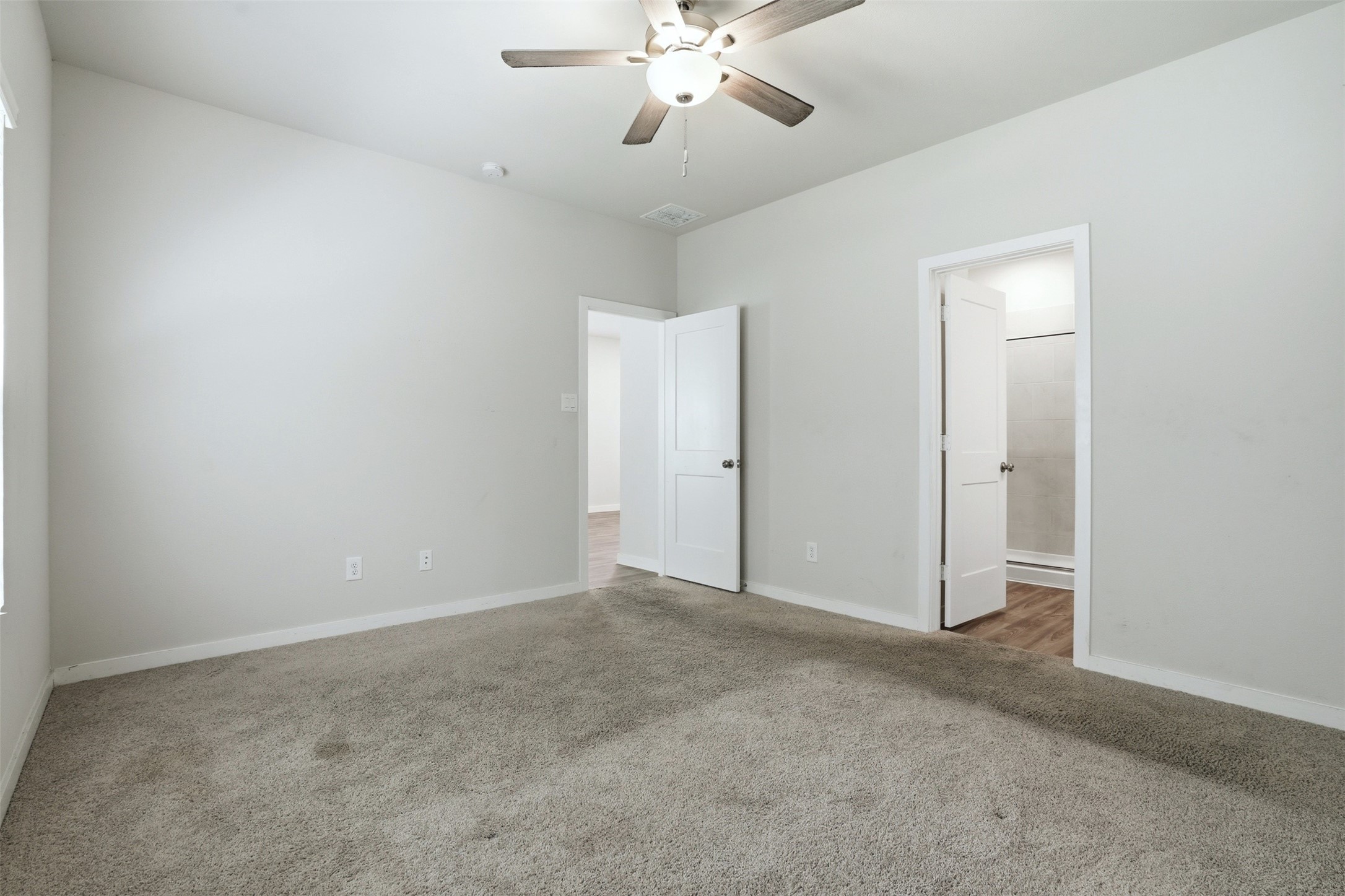 16994 Pandora Way Porter, TX 77365 - Photo 4 of 25 a view of an empty room with a fan
