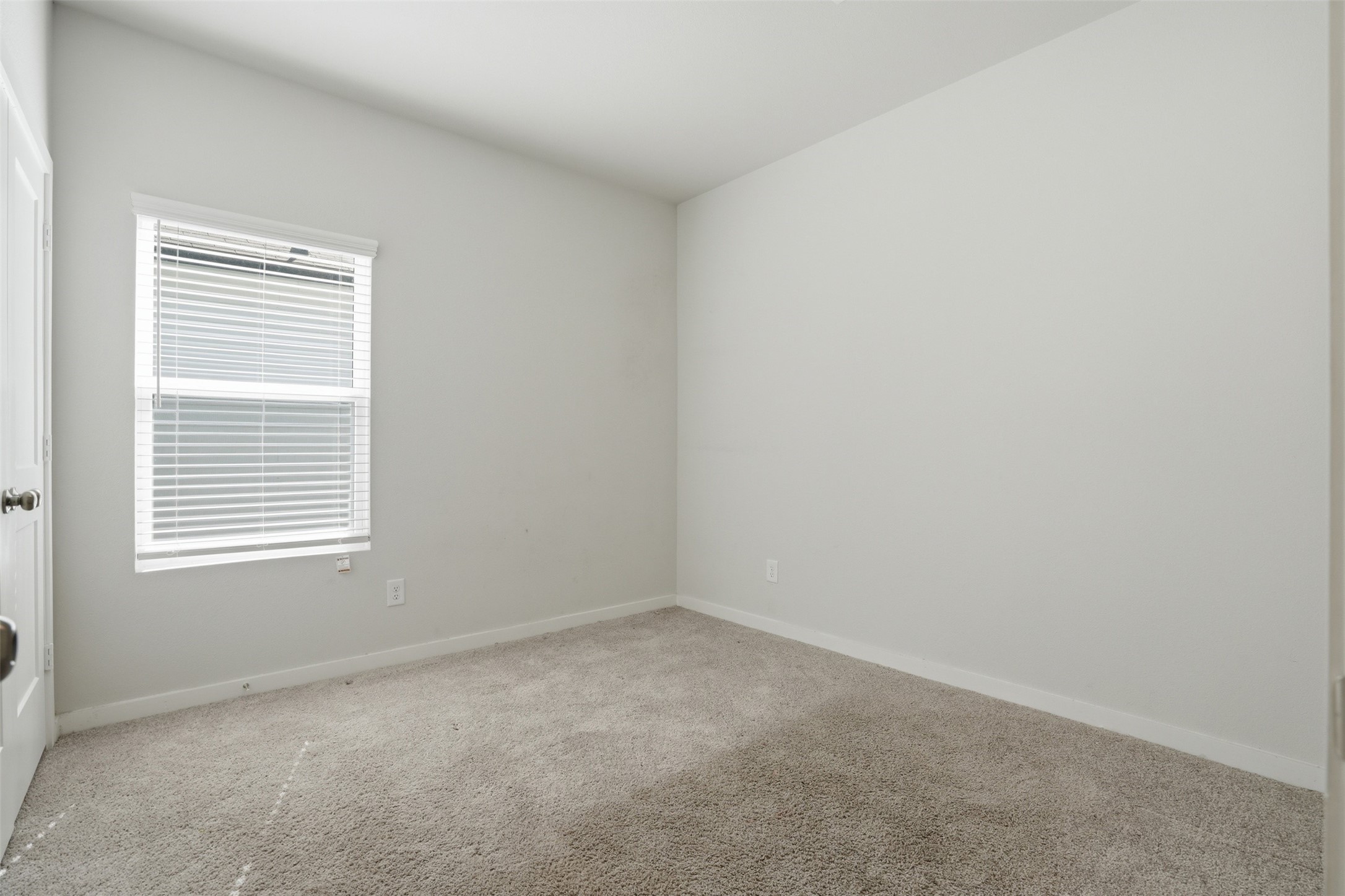 16994 Pandora Way Porter, TX 77365 - Photo 7 of 25 an empty room with a window