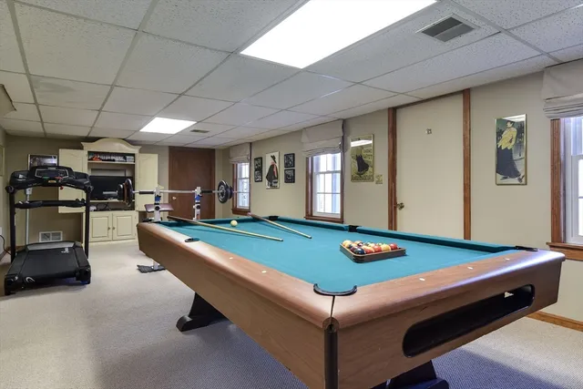 a room with furniture and gym equipment
