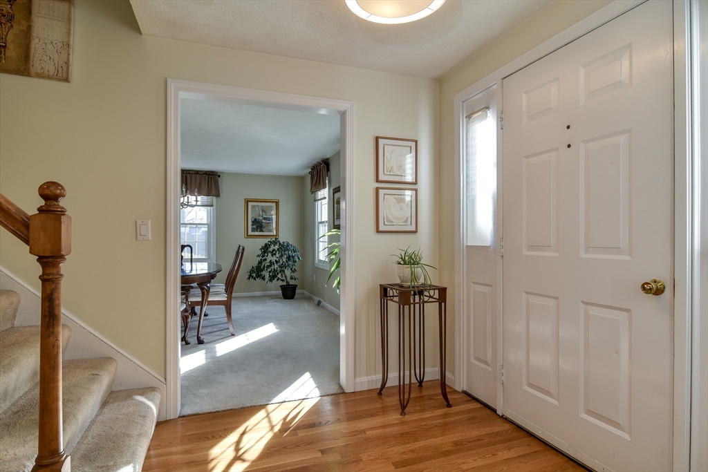 7 Gibbs Valley Path Framingham, MA 01701 - Photo 6 of 39 a view of a livingroom with wooden floor and a bathroom
