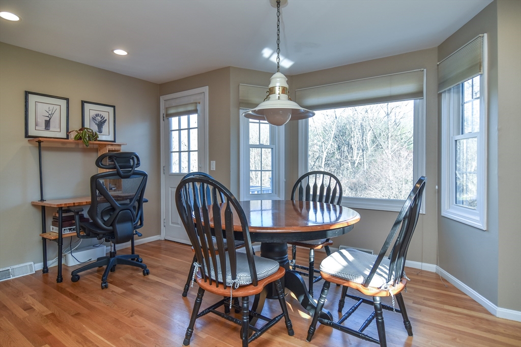 7 Gibbs Valley Path Framingham, MA 01701 - Photo 10 of 39 a view of a dining room with furniture window and wooden floor