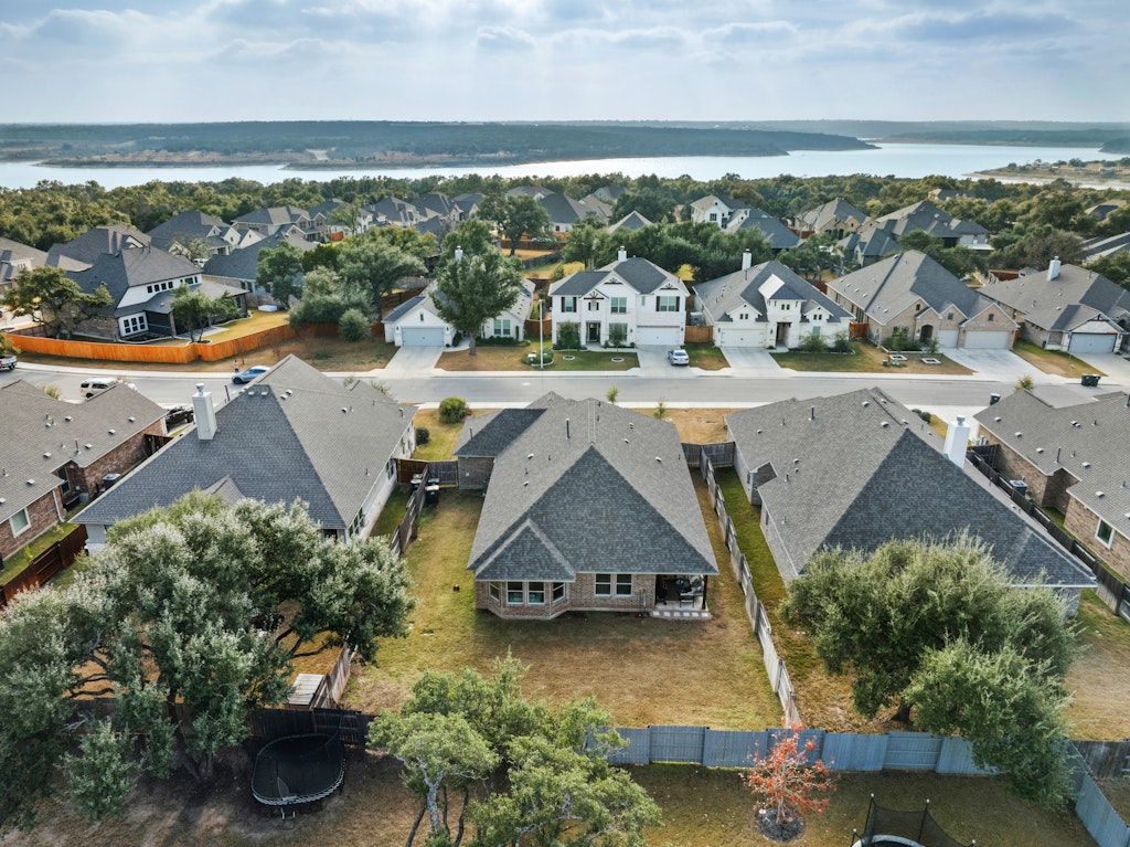 113 Wake Lane Georgetown, TX 78633 - Photo 1 of 33 an aerial view of residential houses with outdoor space