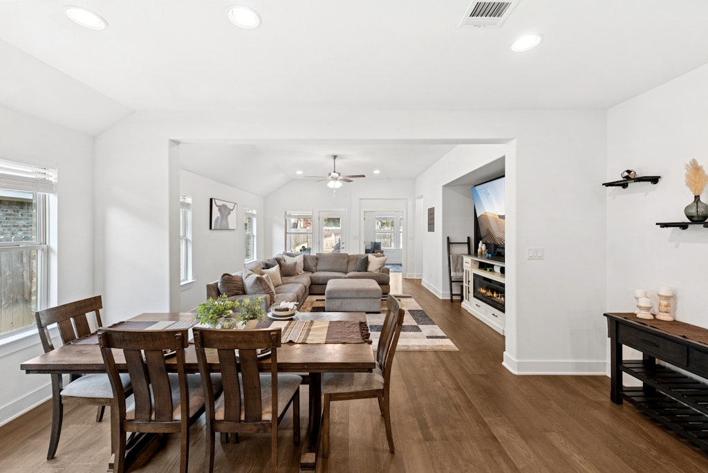 113 Wake Lane Georgetown, TX 78633 - Photo 9 of 33 a view of a dining room with furniture and wooden floor