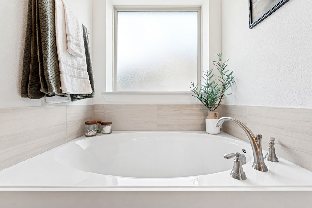 113 Wake Lane Georgetown, TX 78633 - Photo 14 of 33 a white bath tub sitting next to a white sink