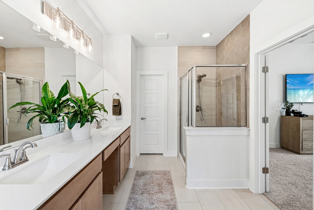 113 Wake Lane Georgetown, TX 78633 - Photo 15 of 33 a bathroom with a shower a sink and a mirror