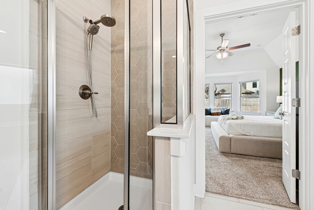 113 Wake Lane Georgetown, TX 78633 - Photo 16 of 33 a bathroom with a tub shower and mirror