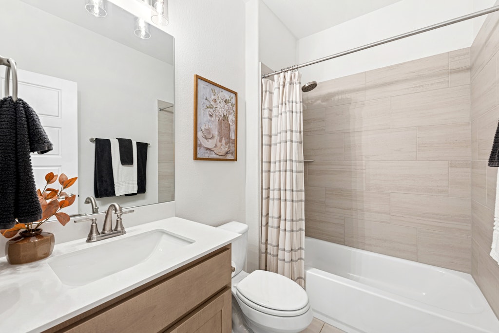 113 Wake Lane Georgetown, TX 78633 - Photo 22 of 33 a bathroom with a sink toilet tub and shower