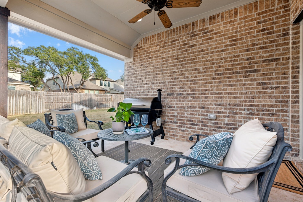 113 Wake Lane Georgetown, TX 78633 - Photo 24 of 33 a view of a patio with couches table and chairs and potted plants