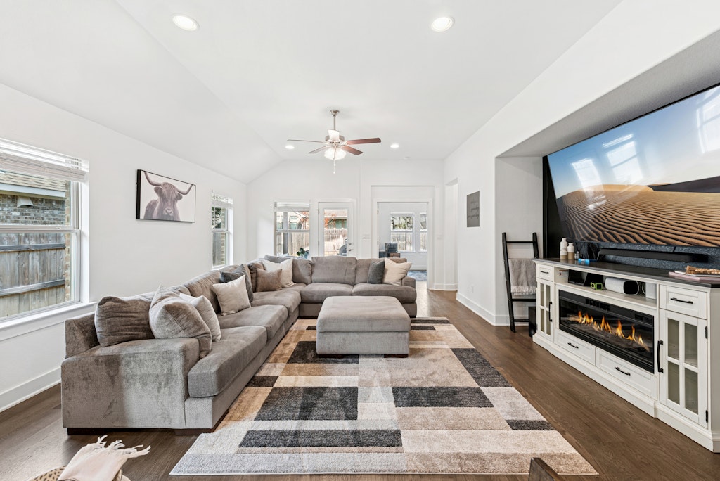 113 Wake Lane Georgetown, TX 78633 - Photo 33 of 33 a living room with furniture a flat screen tv and a rug