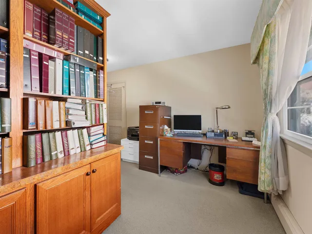 a bathroom with a double vanity sink mirror and toilet