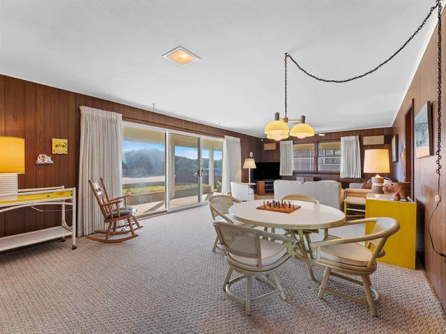 a dining room with furniture and a fireplace