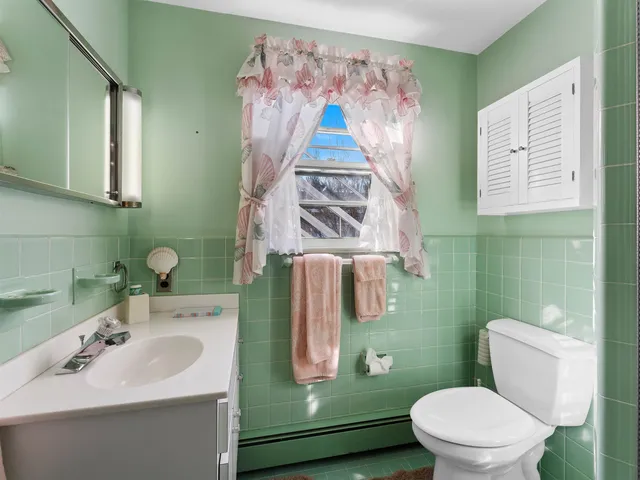 a bathroom with a shower and a sink
