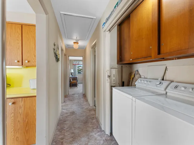 a view of a street with brick building in the background