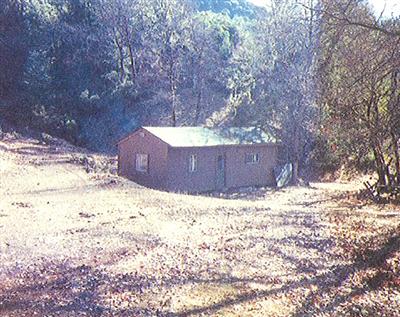 0 Dos Rios Road Laytonville, CA 95454 - Photo 3 of 8 a wooden bench sitting in the middle of a yard