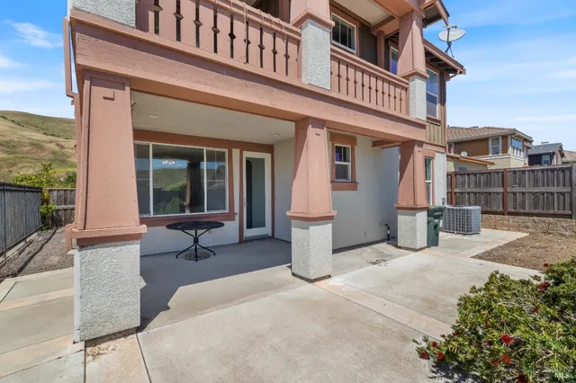a view of a room that has a bed and chair