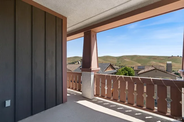 a view of a glass door and balcony