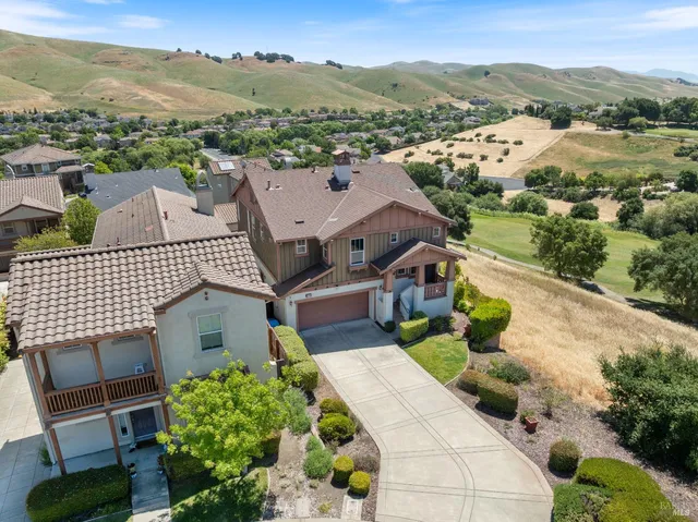 a view of a house with a mountain in the background
