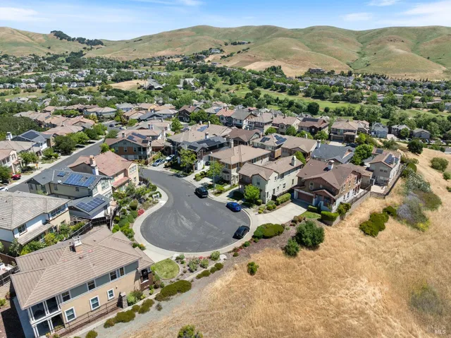 an aerial view of residential houses with outdoor space