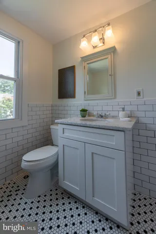 a kitchen with stainless steel appliances a stove a microwave and a sink