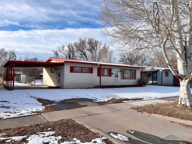 a front view of a house with yard