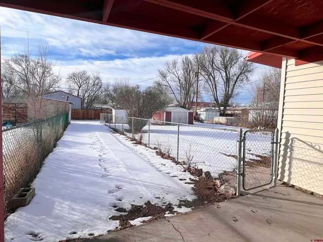 a view of a backyard with sitting area